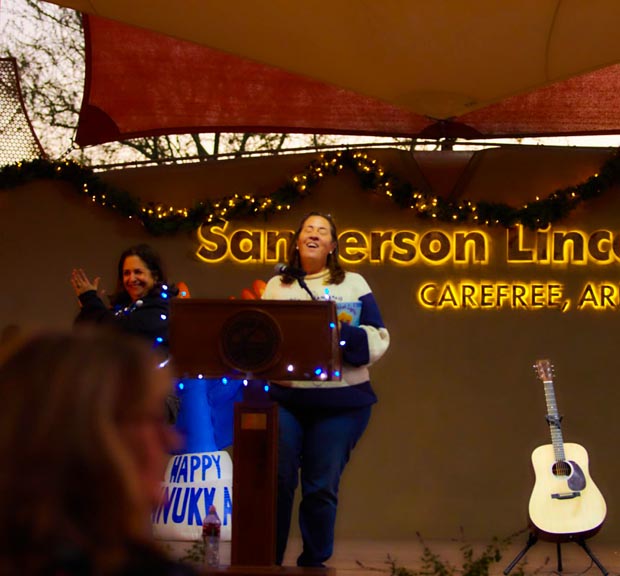 emcee-at-podium-chanukah-in-carefree-2025
